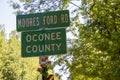 Signs and a photograph at the site of the lynching of four African Americans near Monroe, Georgia